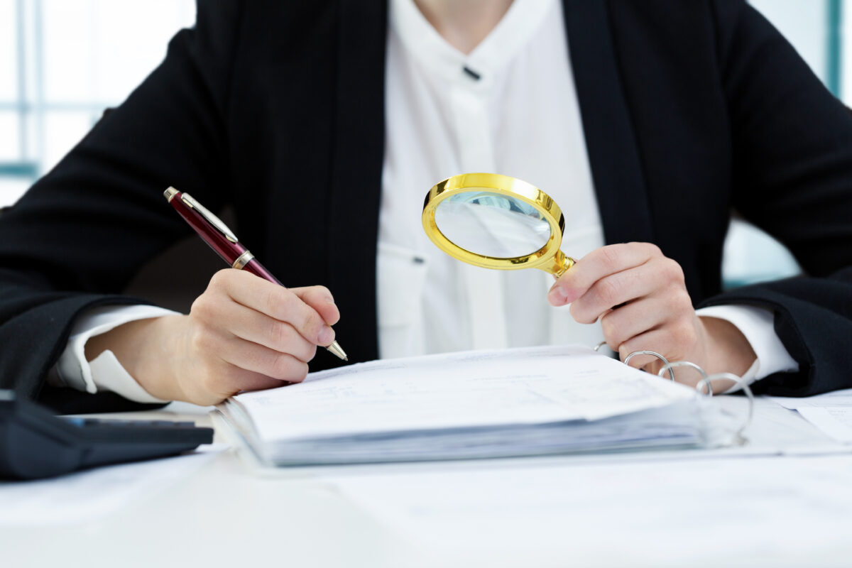 Auditor surveying assisted living facility documents